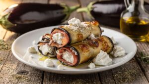 Involtini di melanzane al forno: ripieni di ricotta e prosciutto, pronti in 20 minuti